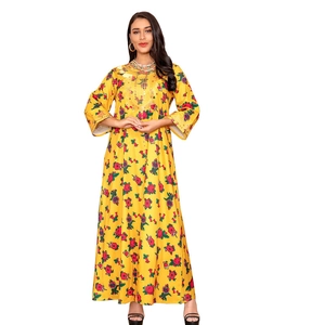 Detailed embroidery on the neckline of a long yellow floral kaftan dress with long sleeves