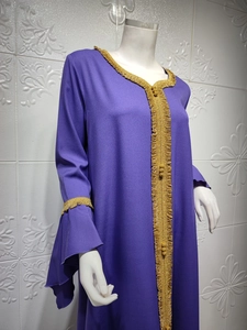 Detailed view of purple abaya with golden wavy lace embroidery on sleeves and front