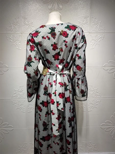 Detailed back view of vintage ethnic mesh dress with floral embroidery and white silk ribbon