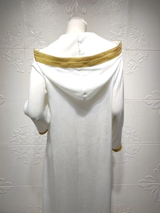 Detail of white hooded thobe robe featuring intricate gold braided lace on hood and sleeves