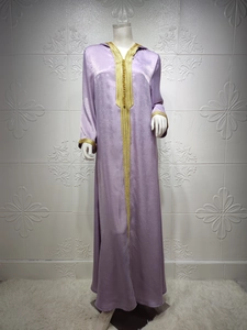 Detailed close-up of lavender silk hooded robe with intricate gold embroidery and trim