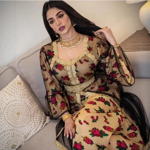 Ethnic apricot maxi dress with floral prints, black mesh layers and gold embroidery