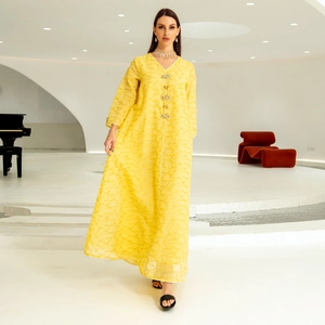 Elegant yellow kaftan dress with mesh embroidery and floral rhinestone button details