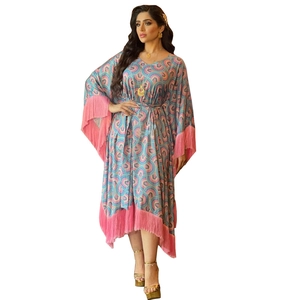 Women's kaftan dress with colorful geometric prints and pink tassel trim detailing