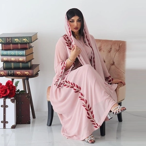 Detailed red leaf embroidery on the neckline and cuffs of pink chiffon abaya dress