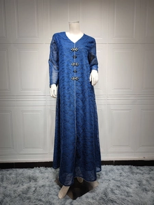 Detail of navy blue mesh embroidery and silver beaded ornaments on an elegant kaftan dress