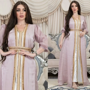 Detailed embroidery on luxury lilac kaftan robe with gold sequin trim and white satin dress