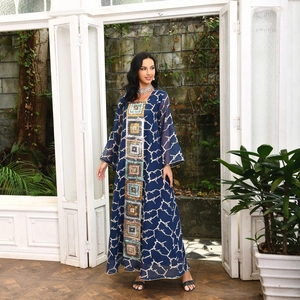 Detail of navy blue long sleeve maxi dress with ethnic embroidery and sequin patterns