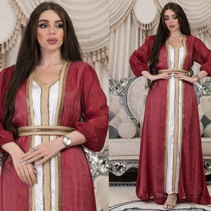 Deep red satin kaftan gown with white lining and intricate gold embroidery details