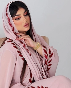 Detail showing high-quality leaf embroidery on the collar and hijab of pink chiffon abaya