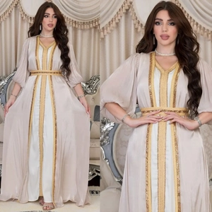 Detailed embroidery on a beige luxury satin kaftan with golden sequins and lantern sleeves