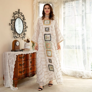 Elegant ivory sequined abaya dress with floral embroidery and long flowy silhouette