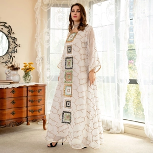 Elegant white long sleeve kaftan dress with sequined patterns and abstract branch texture