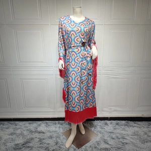 Women's maxi dress with rainbow geometric prints, long sleeves and red fringe details