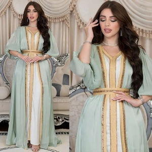 Detailed view of luxury mint green kaftan dress set with gold sequin embroidery detailing
