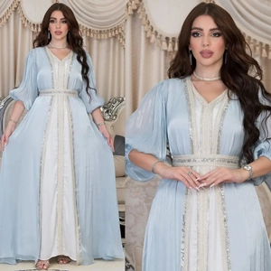 Elegant light blue kaftan dress with silver embroidery and satin lining for formal events