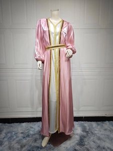 Detail of pink and white satin kaftan set with gold sequin trim and cinched waist
