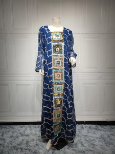 Close-up of bohemian sequins embroidery on dark blue long-sleeve chiffon maxi dress