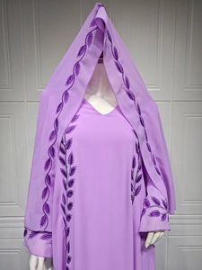 Detail of purple chiffon modest dress featuring intricate embroidery on neckline and hood