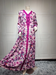 Detail of rose purple floral maxi dress with intricate hand embroidery on the neckline