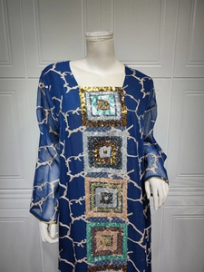 Detail of dark blue dress with sequin square embroidery and delicate floral print