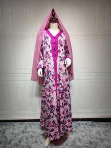 Detailed V-neck embroidery with colorful beads on a pink floral print maxi dress