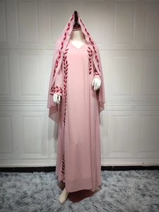 Detail of pink chiffon long dress with red leaf embroidery and matching headscarf