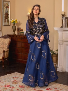 Detailed embroidery and sequins on navy evening gown with gold geometric patterns