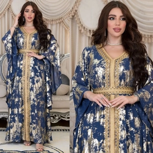 Detail of blue chiffon kaftan dress with golden embroidery and sequin patterns