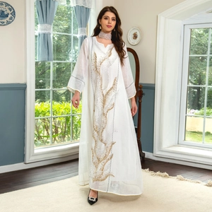 Elegant white maxi kaftan dress with golden sequin embroidery for summer occasions.