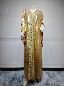 Detail of V-neck gold bronzing chiffon dress with intricate metallic woven lace borders