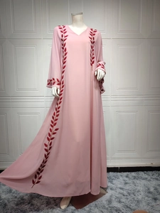 Detail of red leaf embroidery on pink chiffon long dress with matching headscarf