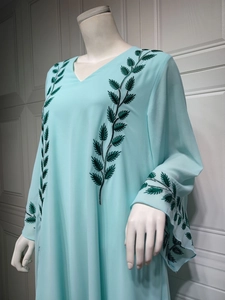 Detail of green leaf embroidery on light blue chiffon long sleeve Abaya dress