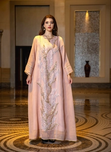 Full view of pink maxi dress featuring intricate gold and silver sequin embroidery.