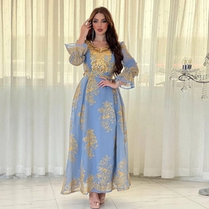 Close-up of sky blue ethnic kaftan dress with intricate gold floral embroidery details