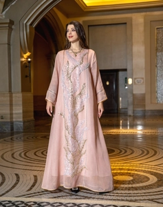 Elegant pink long dress featuring intricate silver and gold sequin embroidery details