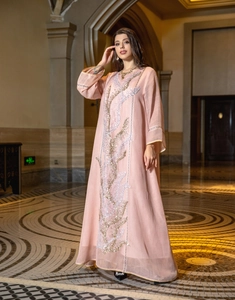 Elegant pink floor-length summer dress featuring intricate sequin embroidery detail