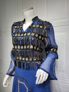 Macro detail of royal blue evening dress with golden and black sequin fringe embroidery