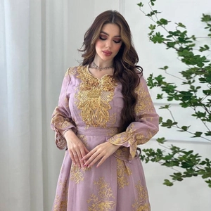 Close-up of golden embroidery details on lavender purple ethnic maxi dress