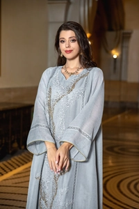 Elegant light blue summer dress featuring intricate silver sequin embroidery details.
