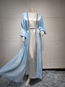 Detailed close-up of silver sequin embroidery on the light blue satin kaftan dress set