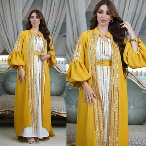 Elegant two-piece abaya set with ginger yellow sequined robe and white inner dress