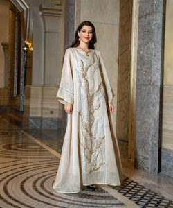 Elegant beige kaftan dress with sequined embroidery for a luxurious evening look.