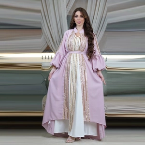 Close-up of pink sequined embroidery and puffy lantern sleeves on this elegant dress