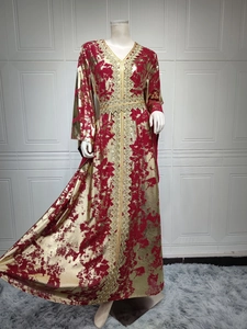 Detailed close-up of golden embroidery on a maroon chiffon long sleeve kaftan dress