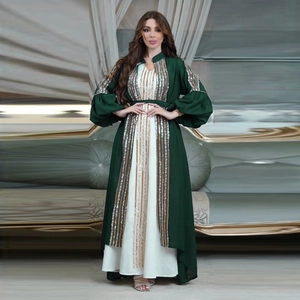 Detail of dark green puff sleeves with intricate gold sequin embroidery on a kaftan set