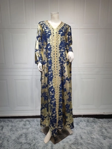 Detailed view of dark blue chiffon dress featuring gold foil print and intricate embroidery