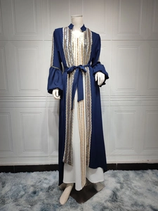 Detail of sequin embroidery on sleeves and placket of a navy blue Muslim abaya set