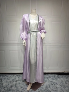 Detail of purple satin abaya dress with silver sequin embellishments and waist belt