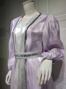 Detailed close-up of silver sequin embroidery on the lavender satin kaftan dress trim